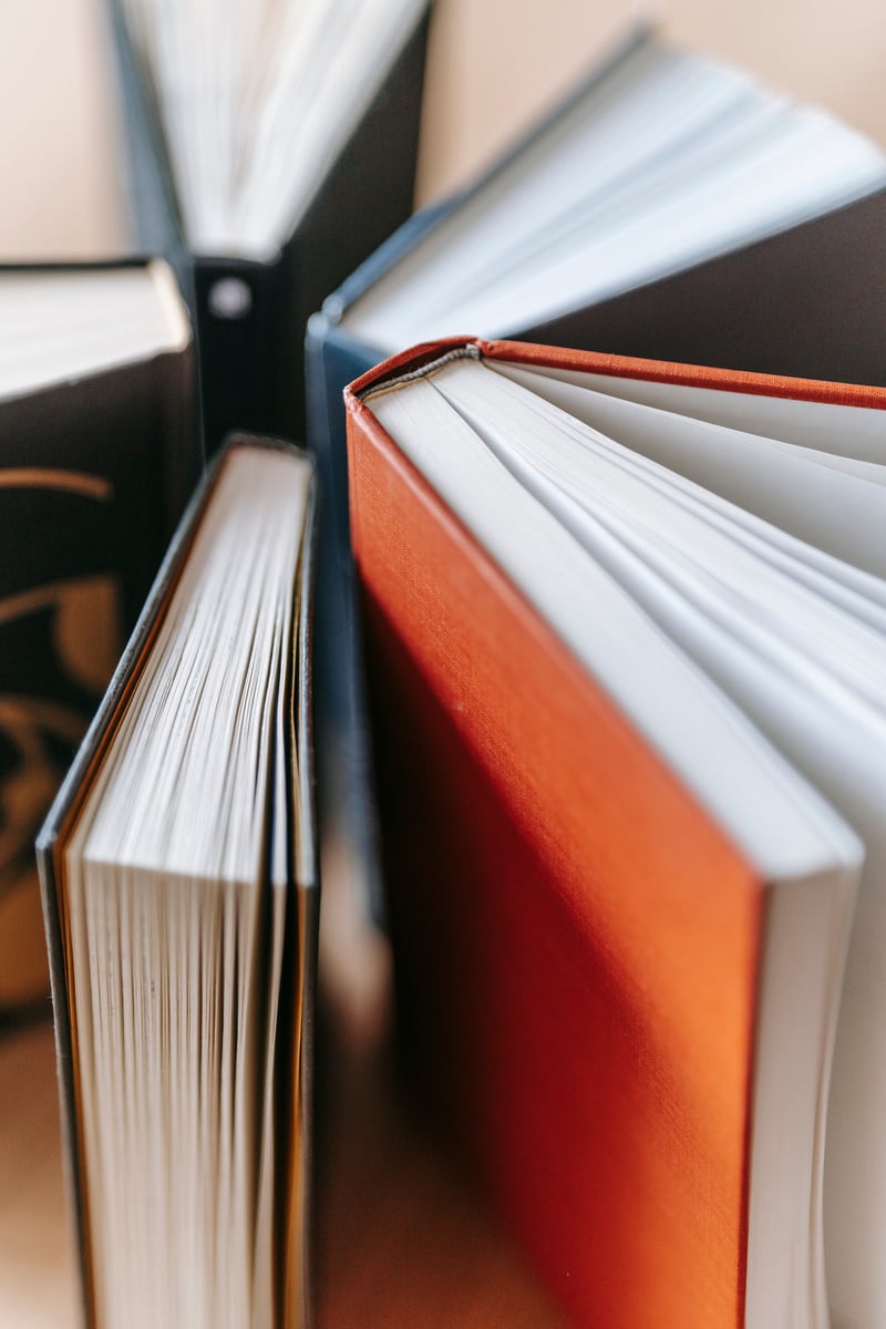 several books are stacked on top of each other